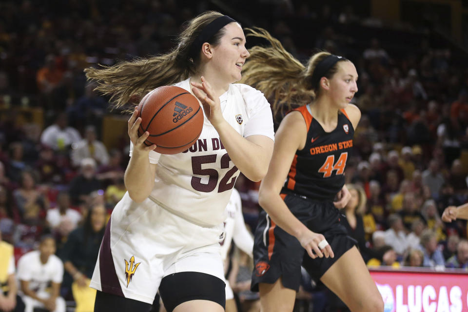 Arizona State's Jamie Ruden (52) looks to pass after winning a rebound against Oregon State's Taylor Jones (44) during the first half of an NCAA college basketball game Sunday, Jan. 12, 2020, in Tempe, Ariz. (AP Photo/Darryl Webb)