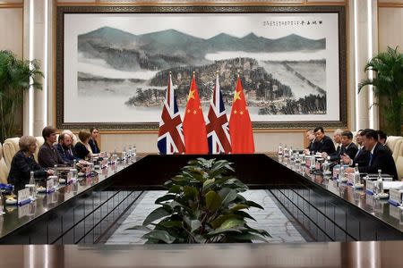 Chinese President Xi Jinping and British Prime Minister Theresa May meet at the West Lake State House on the sidelines of the G20 Summit, in Hangzhou, Zhejiang province, China, September 5, 2016. REUTERS/Etienne Oliveau/Pool