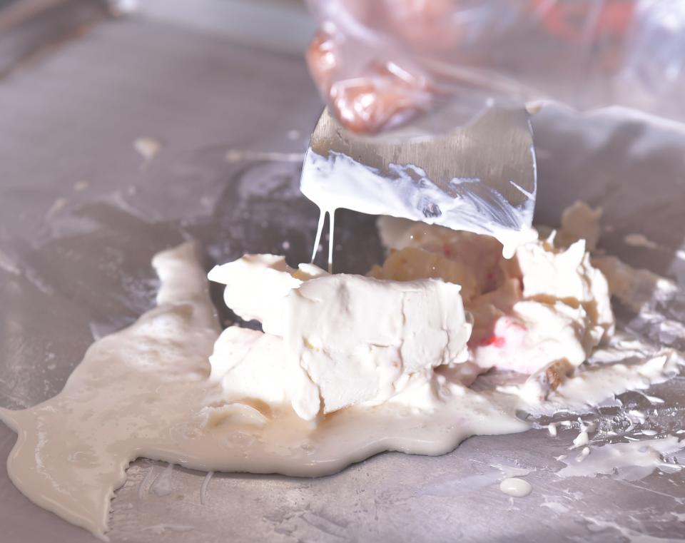 Aldren P. Abraham is the owner of Creamland ice cream shop in
Anderson. Here, Abraham works the ingredients to create on of his specialty ice cream treats on the menu.