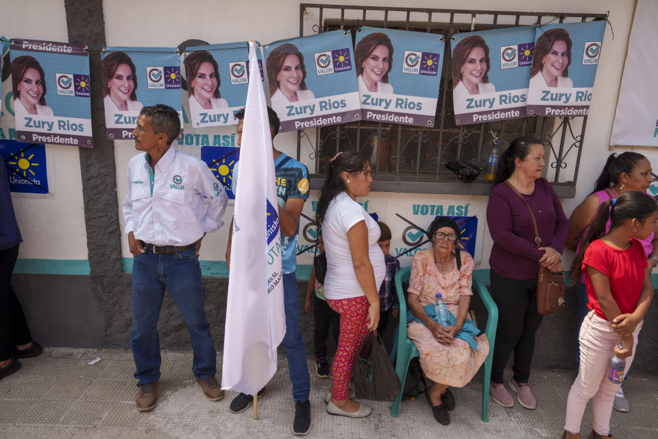 FILE - Residents wait for the start of a campaign rally promoting Zury Rios Sosa, presidential candidate for the Valor and Unionista coalition, in Sansare, Guatemala, June 2, 2023. Guatemalans go to the polls on June 25. (AP Photo/Moises Castillo, File)