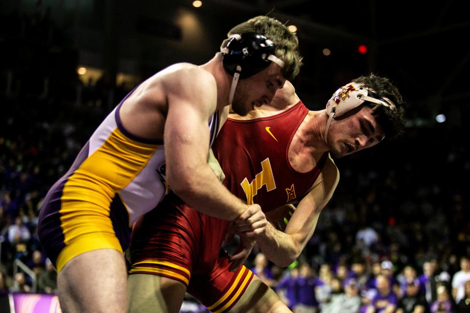 Iowa State's Jarrett Degen, right, wrestles Northern Iowa's Colin Realbuto at 149 pounds on Feb. 11.