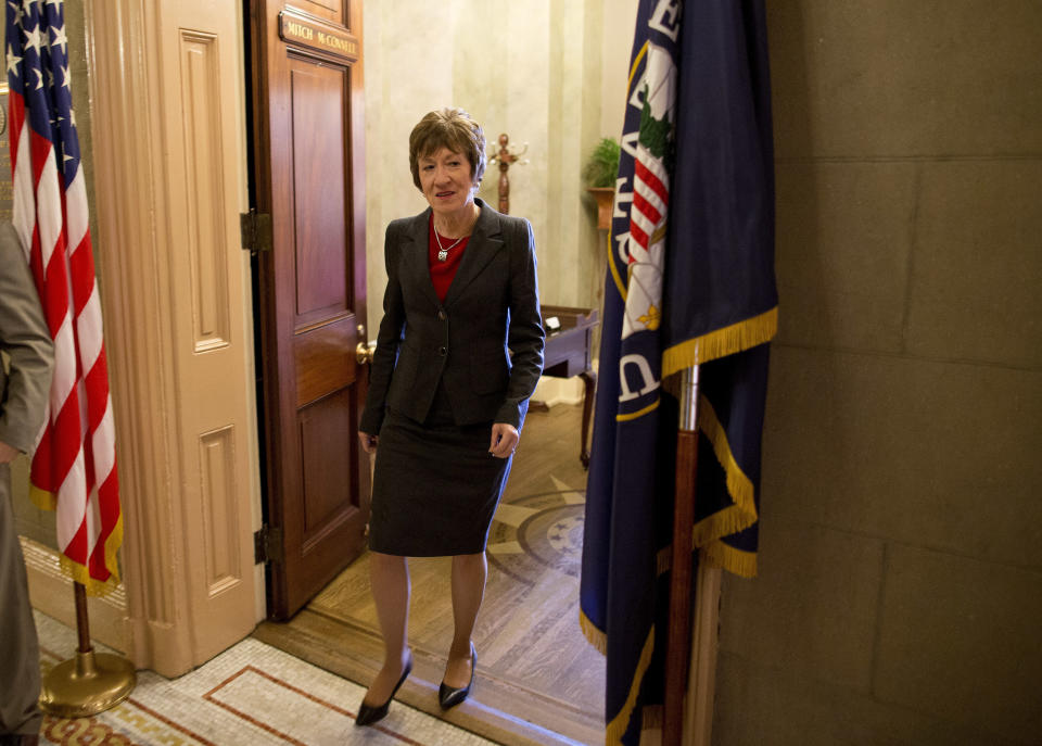 Sen. Susan Collins, R-Maine, walks out of the office of Senate Minority Leader Sen. Mitch McConnell, R-Ky., on Capitol Hill on Wednesday, Oct. 16, 2013 in Washington. (AP Photo/ Evan Vucci)