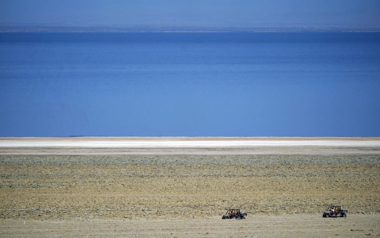 <span class="caption">Off-road vehicles are driven on a property that will be mined for lithium along the Salton Sea, in Niland, Calif., in July 2021. Lithium is critical to rechargeable batteries.</span> <span class="attribution"><span class="source">(AP Photo/Marcio Jose Sanchez)</span></span>