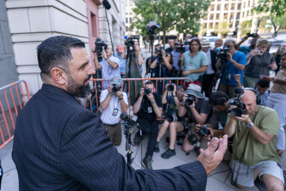 Attorney for Enrique Tarrio, Nayib Hassan speaks with reporters as they depart federal court, Tuesday, Sept. 5, 2023, in Washington. Former Proud Boys leader Enrique Tarrio has been sentenced to 22 years in prison for orchestrating a failed plot to keep Donald Trump in power after the Republican lost the 2020 presidential election. (AP Photo/Alex Brandon)