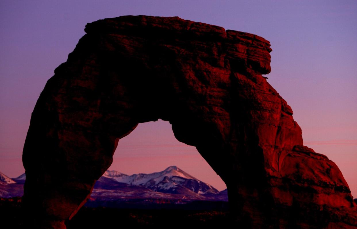 Delicate Arch in Arches National Park at sunset.