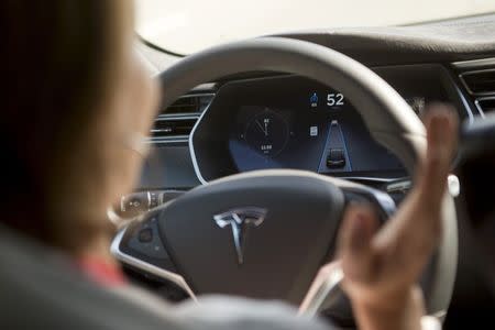 The Tesla Model S version 7.0 software update containing Autopilot features are demonstrated during a Tesla event in Palo Alto, California October 14, 2015. REUTERS/Beck Diefenbach