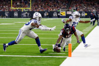 <p>Keke Coutee #16 of the Houston Texans dives for a touchdown defended by Malik Hooker #29 and Kenny Moore #23 of the Indianapolis Colts in the fourth quarter during the Wild Card Round at NRG Stadium on January 5, 2019 in Houston, Texas. (Photo by Bob Levey/Getty Images) </p>