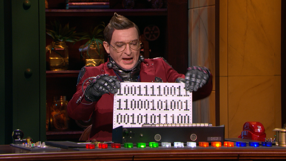 Rhys Darby as The Big Fib robot sidekick C.L.I.V.E. (Disney+)