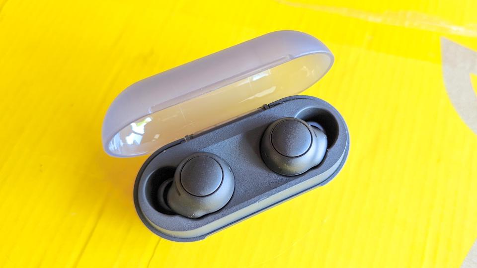 The Sony WF-C500 wireless earbuds sitting in their charging case