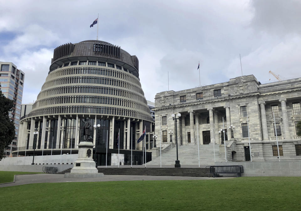 FILE - The New Zealand Parliament buildings, the Beehive on the left, the common name for the Executive Wing of the New Zealand Parliament and Parliament House on the right, in Wellington, New Zealand, Oct. 2017. Denmark, New Zealand and Finland tied for first place in the Transparency International’s 2021 Corruption Perceptions Index, which measures the perception of public sector corruption. The closely watched study finds that most countries have made little to no progress in bringing down corruption levels over the past decade. (AP Photo/Mark Baker, File)