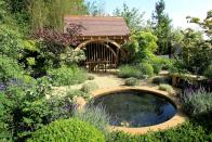 <p>Described as a traditional 'British garden full of plants', Roger's garden at RHS Chelsea in 2010 featured oak pergolas, a circular 'ripple' pool, and a central crescent shape with pathways that led to an oak summerhouse.</p><p><strong>Like this article? <a href="https://hearst.emsecure.net/optiext/cr.aspx?ID=DR9UY9ko5HvLAHeexA2ngSL3t49WvQXSjQZAAXe9gg0Rhtz8pxOWix3TXd_WRbE3fnbQEBkC%2BEWZDx" rel="nofollow noopener" target="_blank" data-ylk="slk:Sign up to our newsletter;elm:context_link;itc:0;sec:content-canvas" class="link ">Sign up to our newsletter</a> to get more articles like this delivered straight to your inbox.</strong></p><p><a class="link " href="https://hearst.emsecure.net/optiext/cr.aspx?ID=DR9UY9ko5HvLAHeexA2ngSL3t49WvQXSjQZAAXe9gg0Rhtz8pxOWix3TXd_WRbE3fnbQEBkC%2BEWZDx" rel="nofollow noopener" target="_blank" data-ylk="slk:SIGN UP;elm:context_link;itc:0;sec:content-canvas">SIGN UP</a></p>