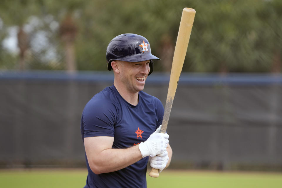 Houston Astros' Alex Bregman smiles after taking his turn at live batting practice during a spring training baseball workout Monday, Feb. 19, 2024, in West Palm Beach, Fla. (AP Photo/Jeff Roberson)