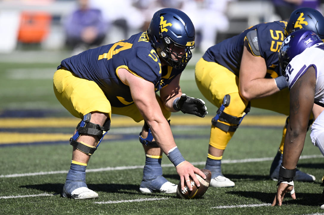 MORGANTOWN, WEST VIRGINIA - OCTOBER 29: Zach Frazier #54 of the West Virginia Mountaineers lines up against the TCU Horned Frogs at Mountaineer Field on October 29, 2022 in Morgantown, West Virginia. (Photo by G Fiume/Getty Images)