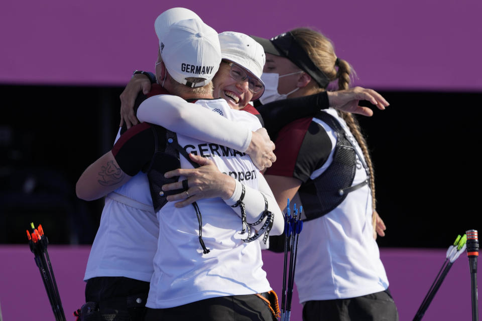 German team celebrate after winning the bronze medal in the women's team competition against Belarus at the 2020 Summer Olympics, Sunday, July 25, 2021, in Tokyo, Japan. (AP Photo/Alessandra Tarantino)