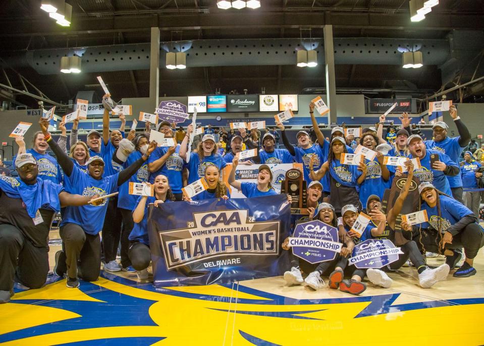 The Blue Hens pose for team pictures after winning the CAA title.