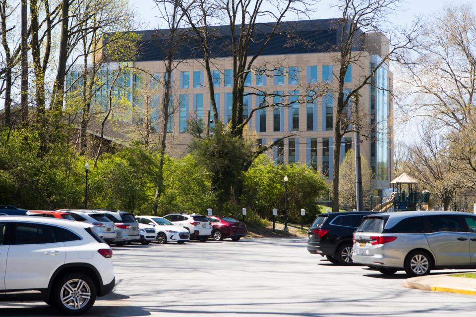 One of the Incyte office building is seen from the parking lot of the Wilmington Friends lower school campus. 