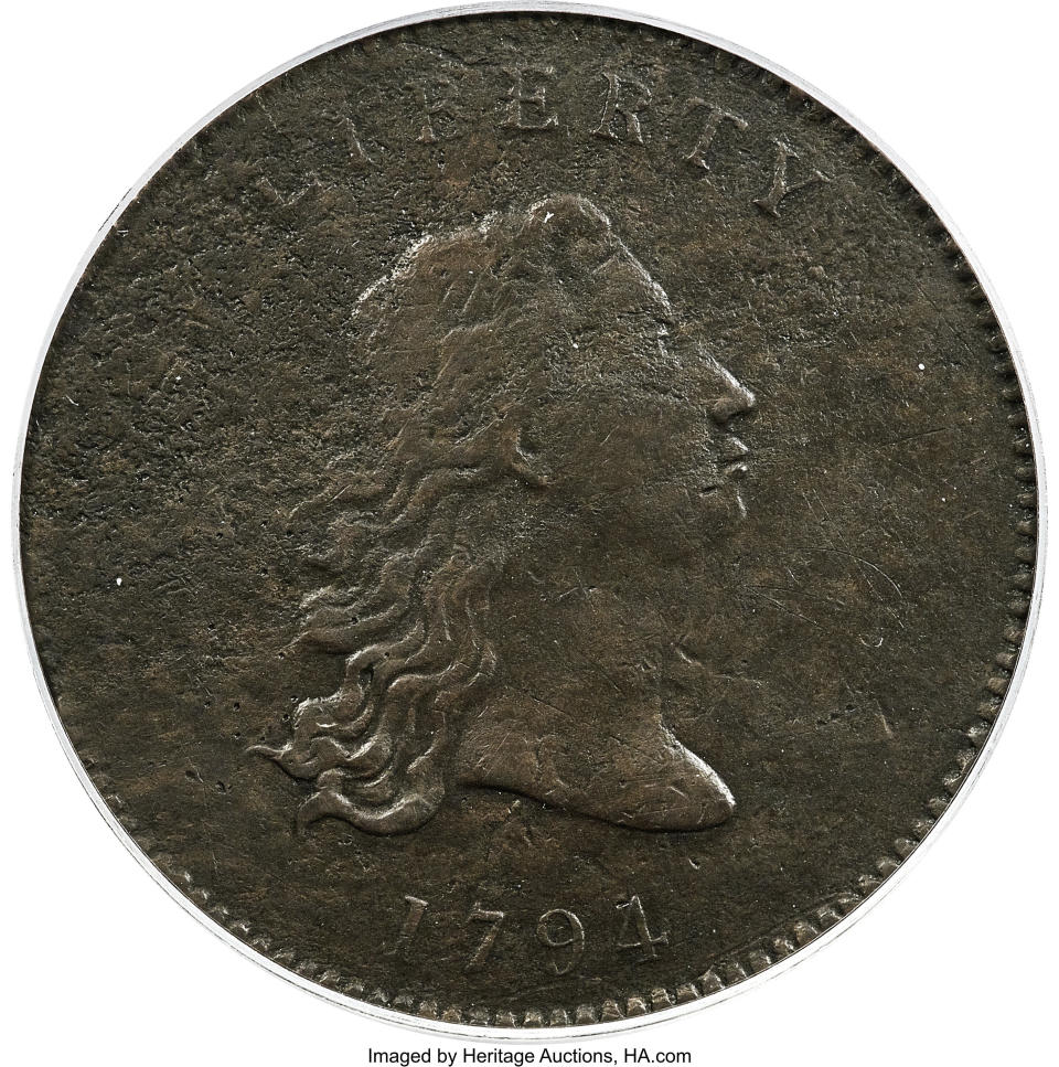 This undated photo provided by Heritage Auctions shows the front of a piece of copper that was struck by the U.S. Mint in Philadelphia in 1794 and was a prototype for the fledgling nation's money. The item, which is known as the “No Stars Flowing Hair Dollar," is owned by businessman and Texas Rangers co-chairman Bob Simpson and will go up for auction at Heritage Auctions in Dallas on Friday, April 23, 2021. (Emily Clements/Heritage Auctions via AP)