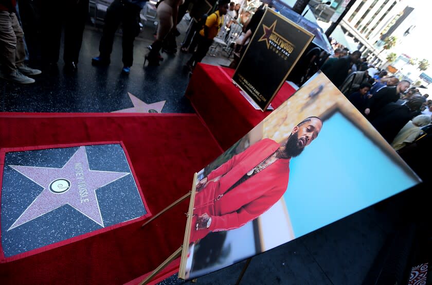 HOLLYWOOD, CALIF. - AUG. 15, 2022. A Hollywood Walk of Fame star for slain rapper Nipsey Hussle was unveiled during a sidewalk ceremony along Hollywood Boulevard in Hollywood on Monday, Aug. 15, 2022. Hussle was shot multiple times outside his South Los Angeles clothing store in 2019 by an associate over a personal matter. He was known and beloved for his community activism and local philanthropy. (Luis Sinc0 / Los Angeles Times)