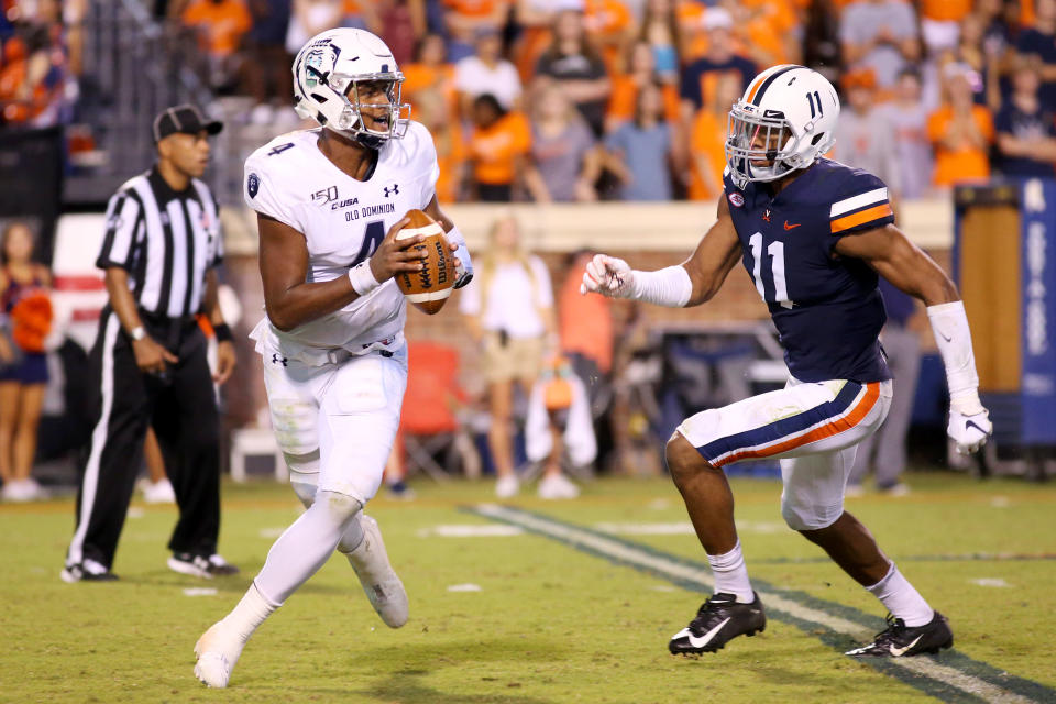Virginia EDGE-LB Charles Snowden, right, had a brilliant game last week. (Getty Images)
