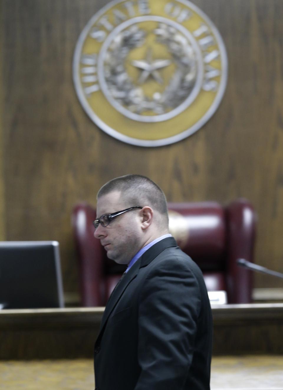 Eddie Ray Routh walks across the court  after a break during his capital murder trial at the Erath County, Donald R. Jones Justice Center Friday, Feb. 20, 2015, in Stephenville, Texas. Routh, 27, of Lancaster, is charged with the 2013 deaths of Navy SEAL Chris Kyle and his friend Chad Littlefield at a shooting range near Glen Rose, Texas. (AP Photo/LM Otero,Pool)