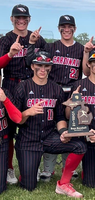 Johannesburg-Lewiston's Preston Marlatt, No. 11, and Colin Basinski, No. 20, pose with the Division 4 District championship. Marlatt was named to the MHSBCA's All-State first team while Basinski was named second team.