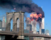 The South Tower of the World Trade Center explodes in flames after being hit by the hijacked airliner now universally known as "the second plane," United Airlines Flight 175, September 11, 2001. This photo -- with its black smoke; the shocking, brilliant, colossal flames; the cloudless sky; the beautiful Brooklyn Bridge flying the American flag -- captures so much of the story of the day that, if one were to create a composite picture to illustrate the idea of "9/11," the result might look very much like this astonishing shot. <br><br>(Photo: STR/Reuters /Landov)<br><br>For the full photo collection, go to <a href="http://www.life.com/gallery/59971/911-the-25-most-powerful-photos#index/0" rel="nofollow noopener" target="_blank" data-ylk="slk:LIFE.com;elm:context_link;itc:0;sec:content-canvas" class="link ">LIFE.com</a>