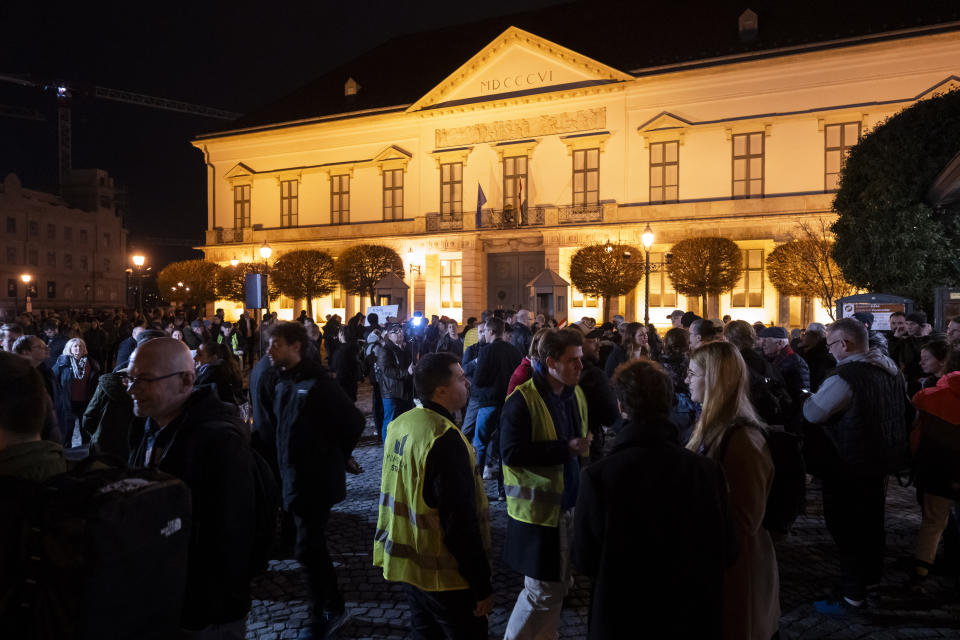 People gather in front of Sandor Palace, office of the Hungarian President, in Budapest, Saturday, Feb. 10, 2024. Hungary’s conservative president Katalin Novák has resigned amid public outcry over a pardon she granted to a man convicted as an accomplice in a child sexual abuse case, a decision that unleashed an unprecedented political scandal for the long-serving nationalist government. (AP Photo/Denes Erdos)