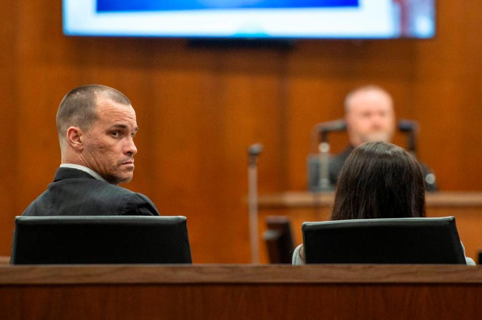 Gary Wayne Wallace looks back at those sitting in the audience during his murder trial at Harrison County Circuit Court in Biloxi on Tuesday, March 8, 2022.