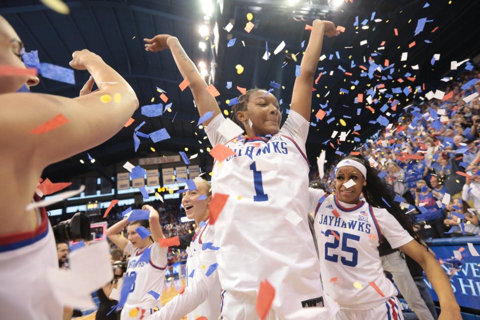 Kansas center Taiyanna Jackson (1) throws up confetti after the WNIT championship game victory against Columbia this past season inside Allen Fieldhouse.