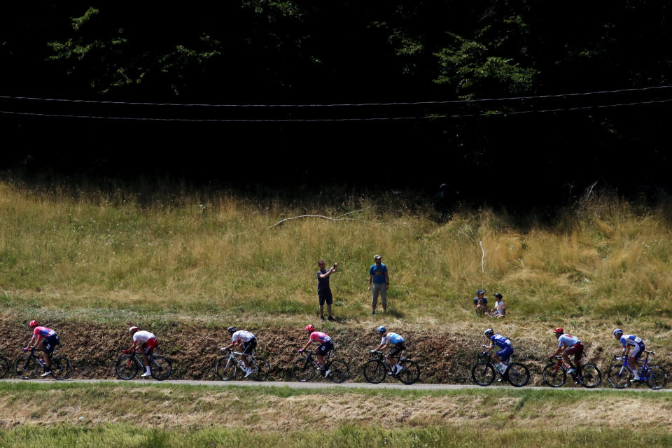 The pack rides during the eighth stage of the Tour de France cycling race over 200 kilometers (125 miles) with start in Macon and finish in Saint Etienne, France, Saturday, July 13, 2019. (AP Photo/Christophe Ena)