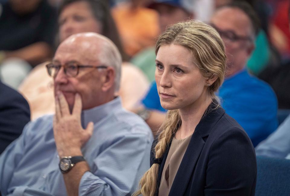 Paige Bellissimo, right, and Michael Stone attend the Wellington's Equestrian Preserve Committee meeting on whether to approve the Wellington North proposal to build new luxury homes and expand the equestrian showgrounds on Wednesday, June 7, 2023 in Wellington, Florida. The committee recommended the village not approve the proposal.