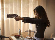Kate Beckinsale plays Lori Quaid, his mysterious wife.