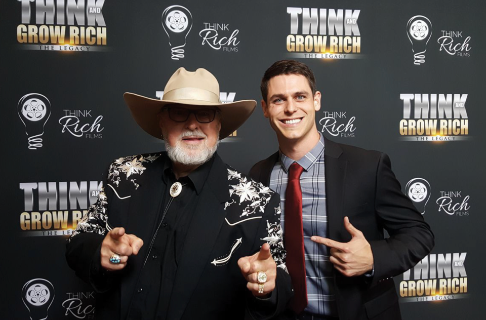 "Cactus Jack" Barringer, left, and Brandon T. Adams pose on the red carpet at the premiere of the movie "Think and Grow Rich."