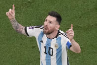 Argentina's Lionel Messi celebrates scoring his side's first goal during the World Cup final soccer match between Argentina and France at the Lusail Stadium in Lusail, Qatar, Sunday, Dec. 18, 2022. (AP Photo/Thanassis Stavrakis)
