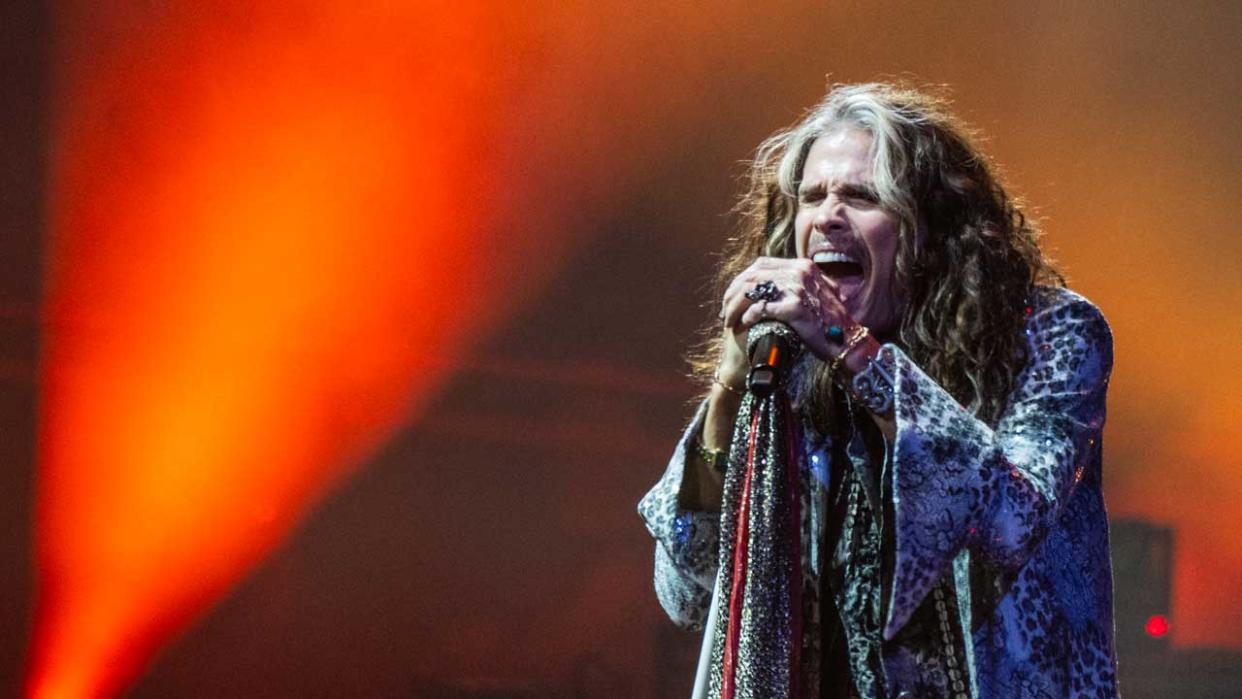  Steven Tyler singing onstage. 