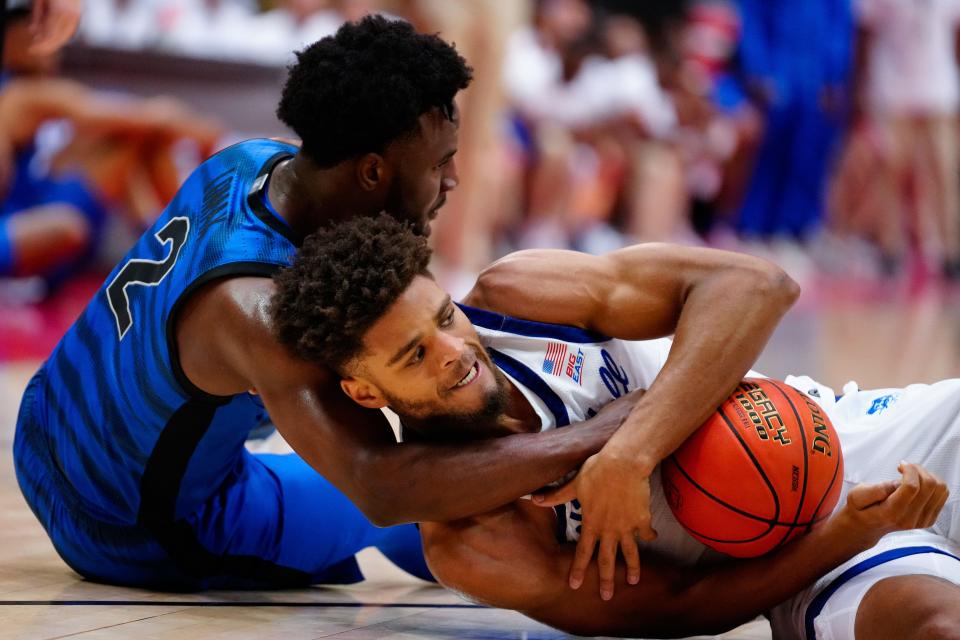 Seton Hall Pirates forward Tray Jackson (1) and Memphis Tigers guard Alex Lomax (2) battle for the ball during the first half at ESPN Wide World of Sports.