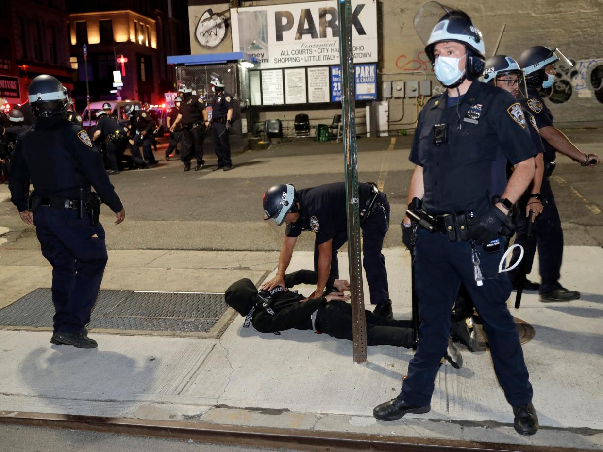 Police officers arrest a protester in New York, Monday, June 1, 2020.(AP Photo:Seth Wenig)