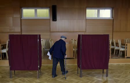 A voter arrives to cast his ballot at a polling station during the country's parliamentary election in the village of Ruzindol, Slovakia, March 5, 2016. REUTERS/David W Cerny