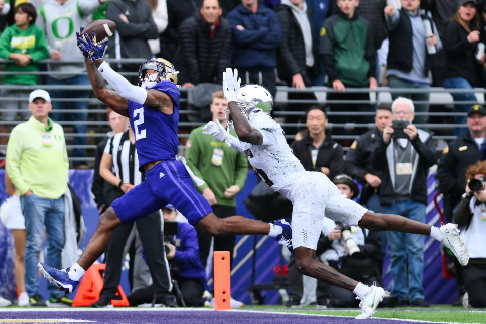 Oct 14, 2023; Seattle, Washington, USA; Washington Huskies wide receiver Ja’Lynn Polk (2) catches a pass for a touchdown against the Oregon Ducks during the first half at Alaska Airlines Field at Husky Stadium. Mandatory Credit: Steven Bisig-USA TODAY Sports