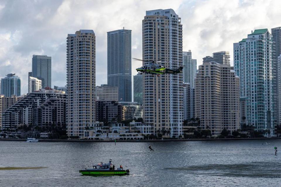 A Miami-Dade Fire-Rescue helicopter approaches a boat to perform a rescue during a South Florida Public Safety Regional Assets in Action Demonstration showcasing an active threat response incident in Biscayne Bay as part of the annual 2024 National Homeland Security Conference at PortMiami, Terminal J on Wednesday, July 24, 2024, in Miami, Fla.