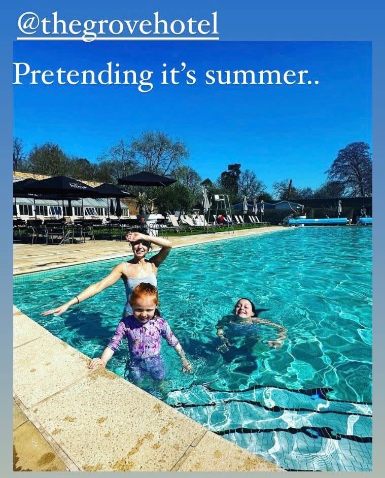 Helen posed at the pool with her daughters