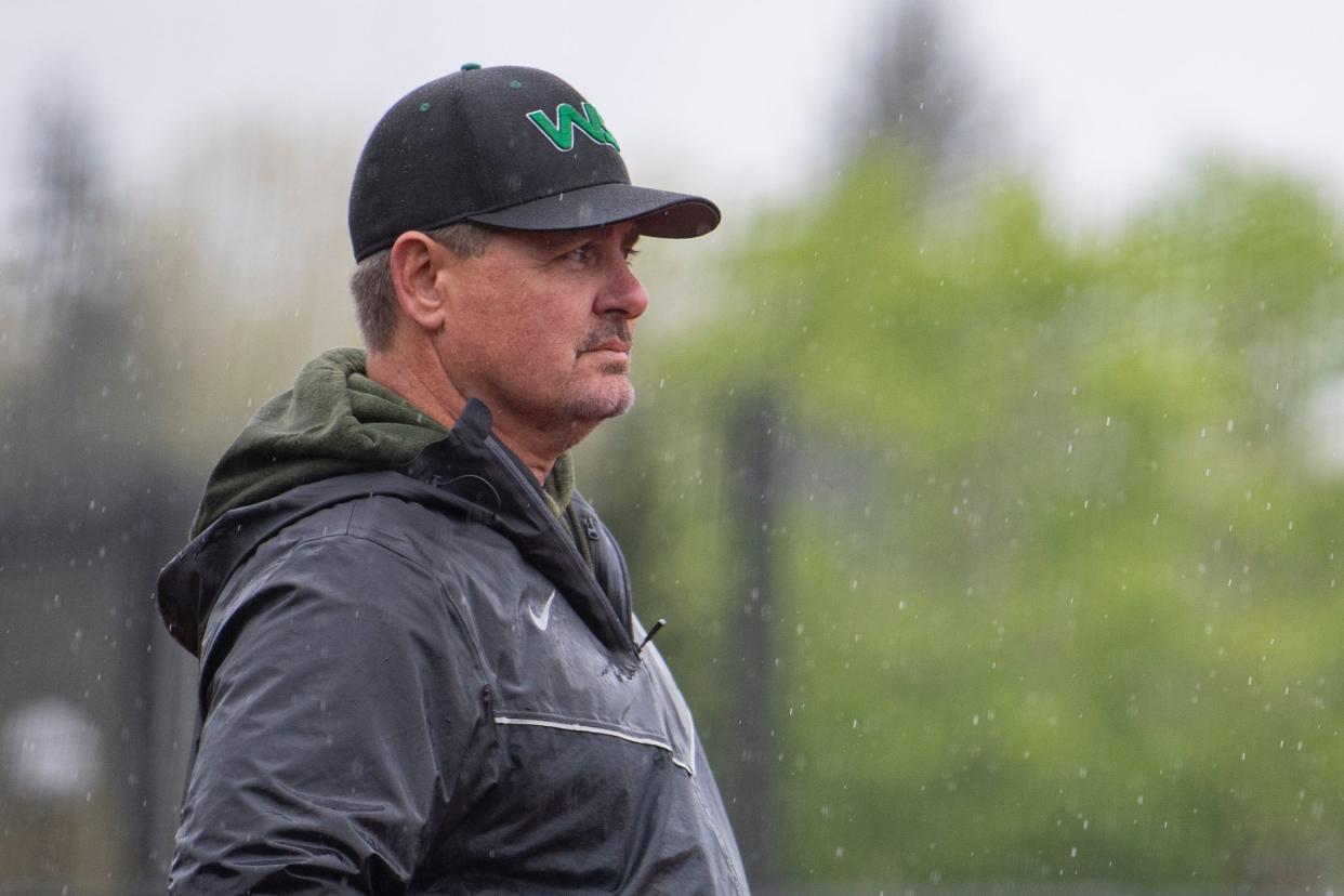 West Salem softball head coach Ty Nicholson watches his team play during a league matchup against South Salem at Western Oregon University on Friday, May 3, 2024, in Monmouth, Ore.