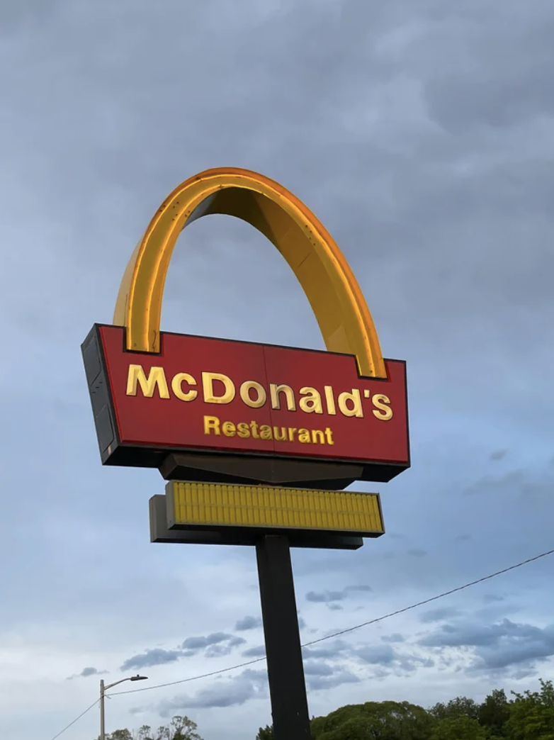 A McDonald's sign with one arch