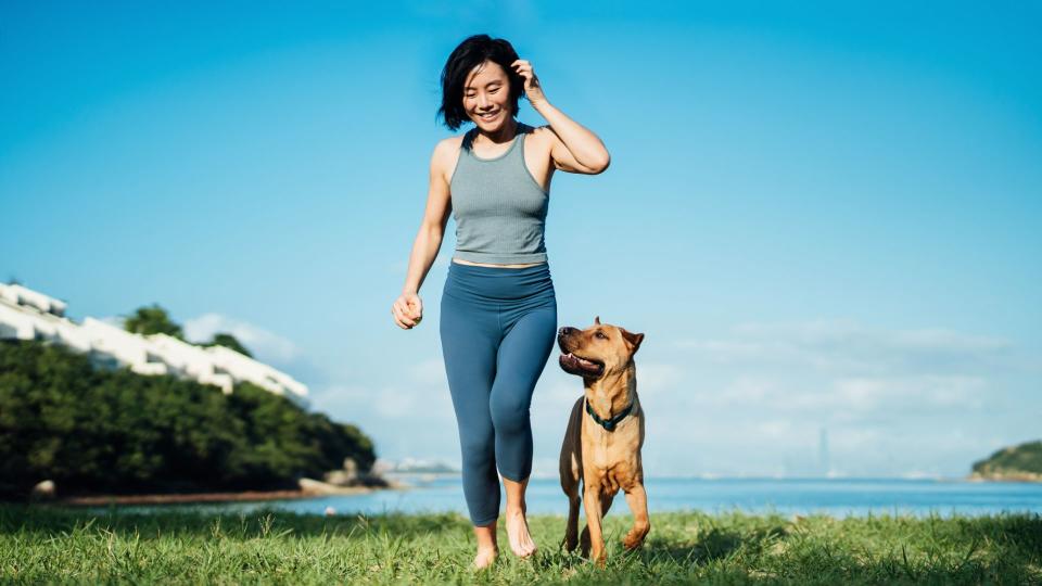 Woman running with dog