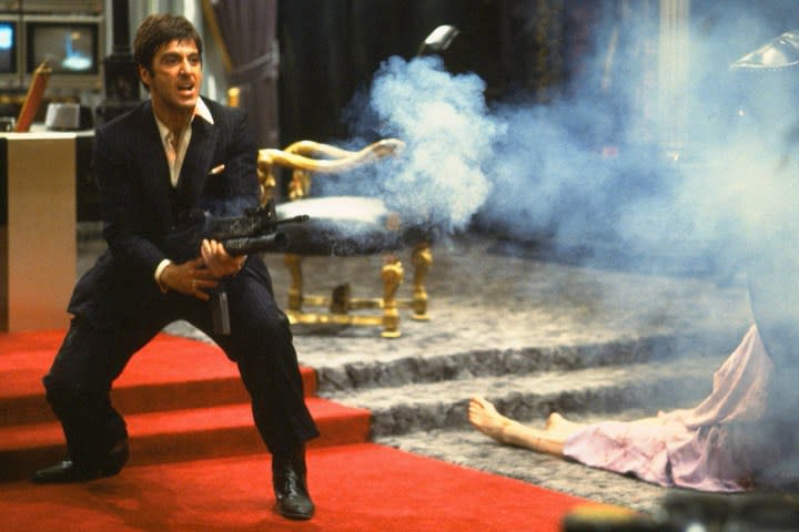 Al Pacino holding a gun in Scarface.