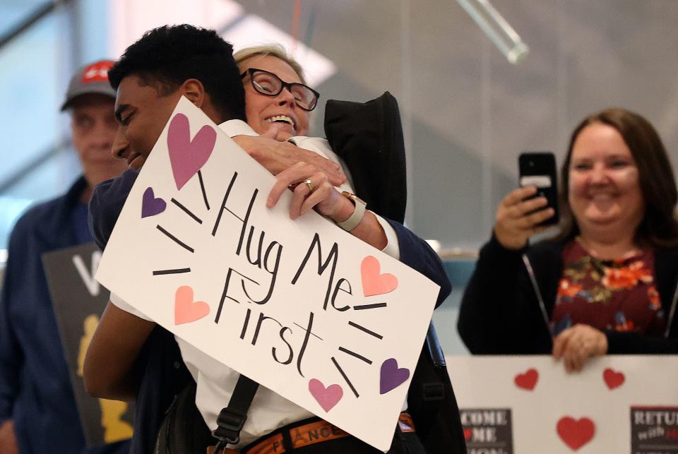 Janet Mathews hugs her son Elder Nick Coggins as he arrives home from serving a mission on the Ivory Coast at the Salt Lake City International Airport in Salt Lake City on Tuesday, June 20, 2023. | Kristin Murphy, Deseret News