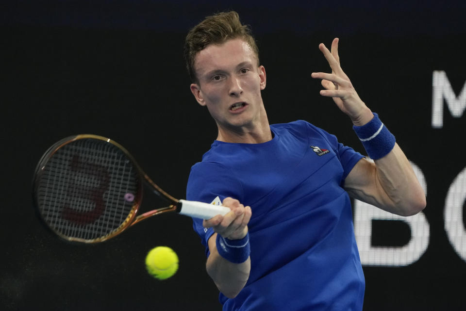 Jiri Lehecka of the Czech Republic plays a forehand return to United States' Taylor Fritz during their Group C match at the United Cup tennis event in Sydney, Australia, Thursday, Dec. 29, 2022. (AP Photo/Mark Baker)