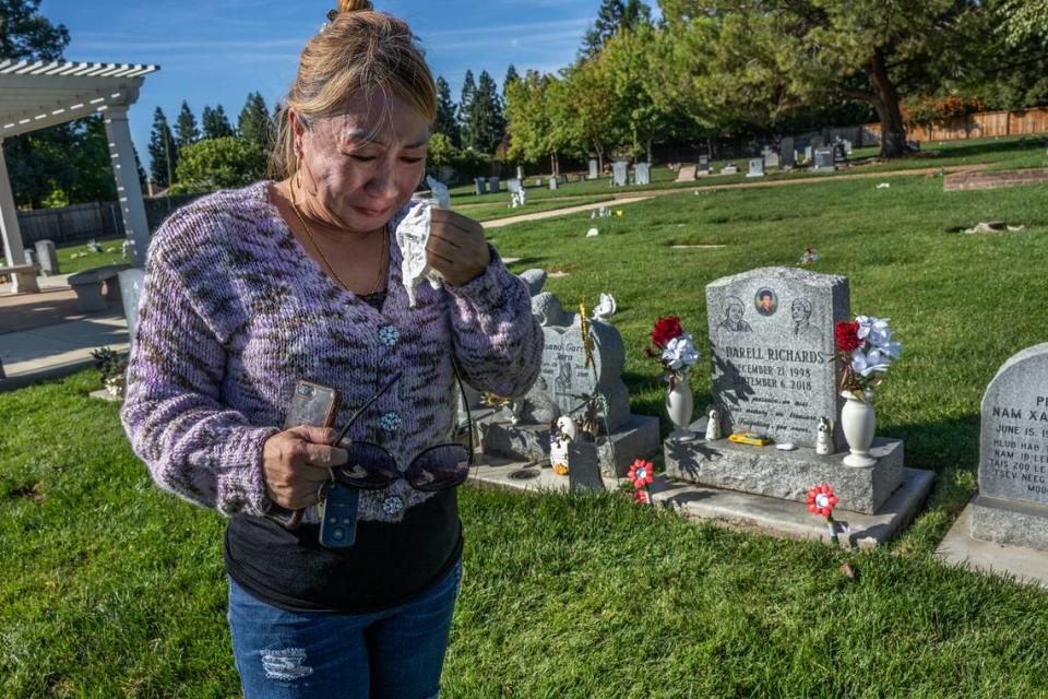 Khoua “Christine” Vang sobs after drying her eyes from tears as she visits her son Darell Richards’ grave on Monday in Elk Grove. “I’m disappointed in the entire system. I feel like everyone failed my son,” Vang said. Renée C. Byer/rbyer@sacbee.com