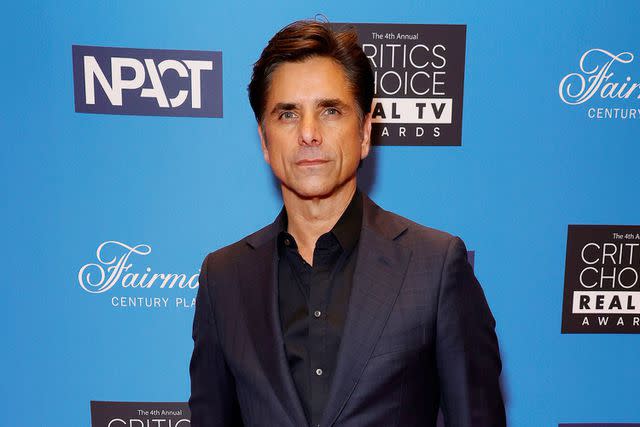 <p>Frazer Harrison/Getty</p> John Stamos is pictured attending the 4th Annual Critics Choice Real TV Awards at Fairmont Century Plaza on June 12, 2022 in Los Angeles, California.