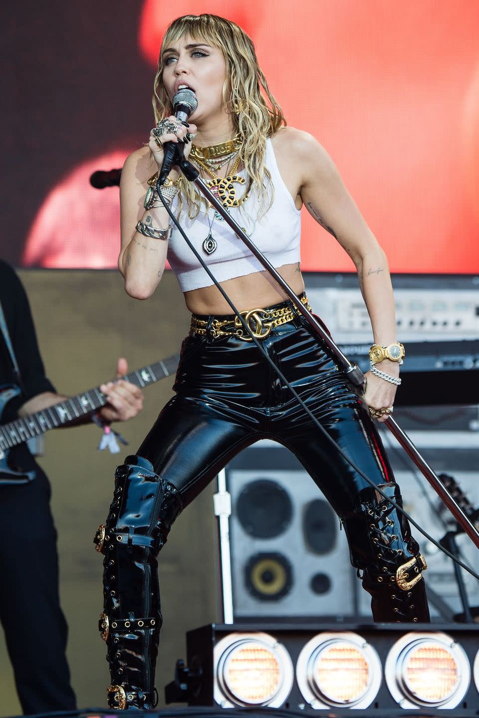 <p>For her headline slot last year on the Pyramid stage, Miley Cyrus entertained fans in the scorching heat in a crop top and PVC trousers.</p>